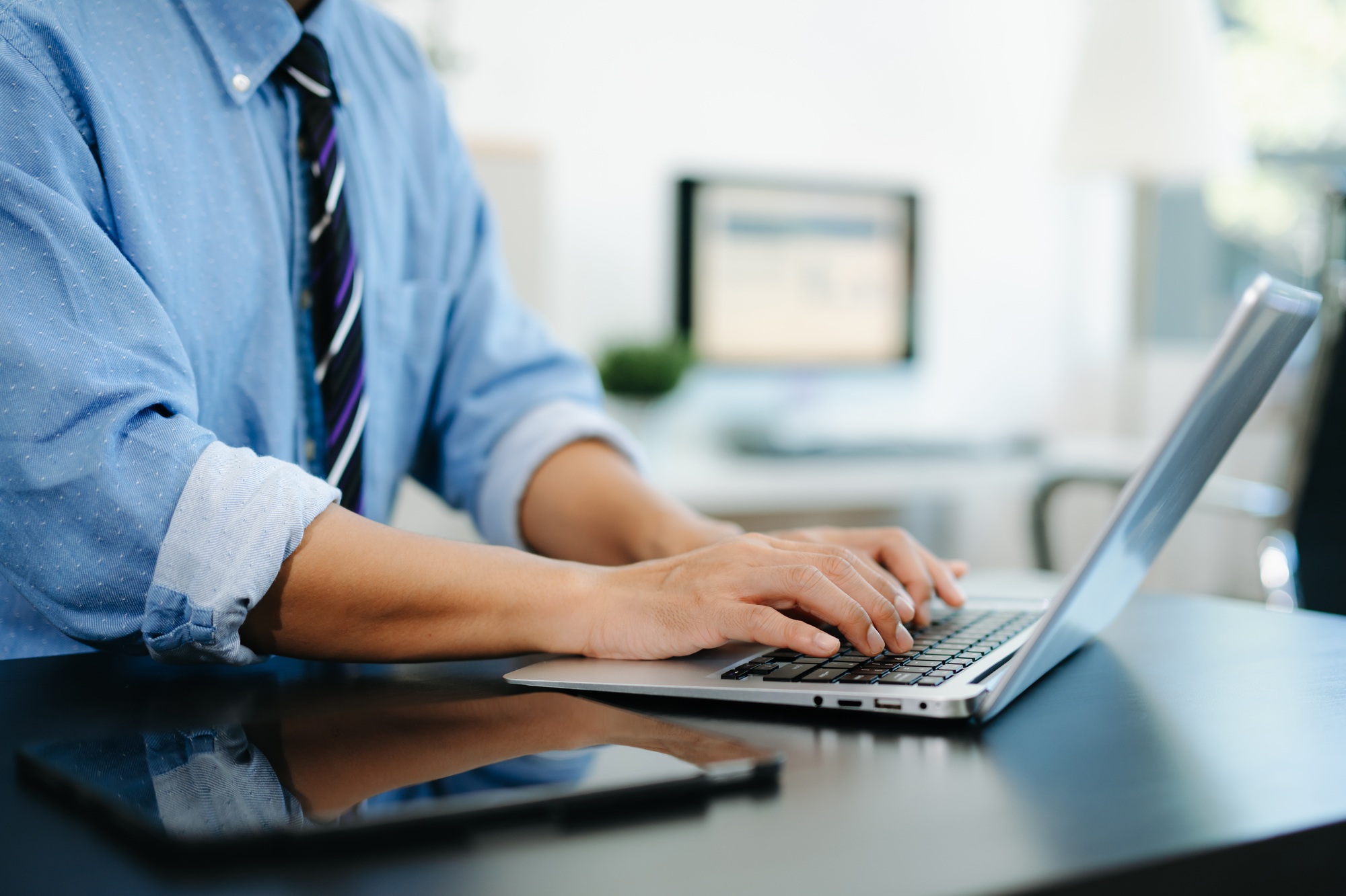 Businessman hands typing on smartphone, tablet and laptop keyboard computer, typing, online